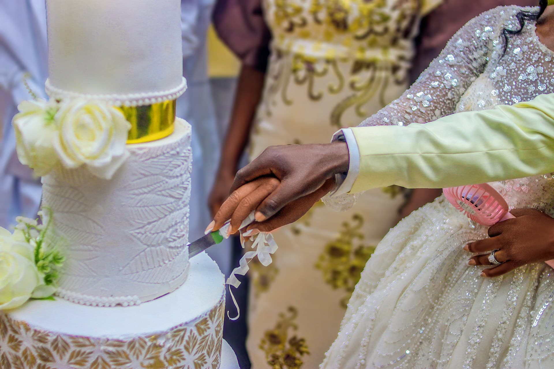 Person cutting birthday cake, representing celebration dreams